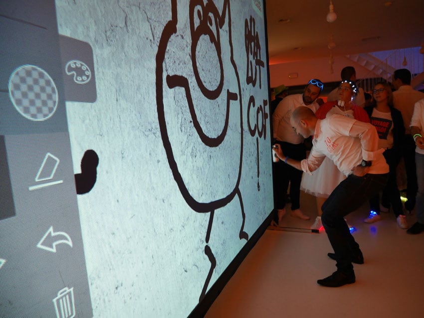 Spraying digital graffiti during an event in France.